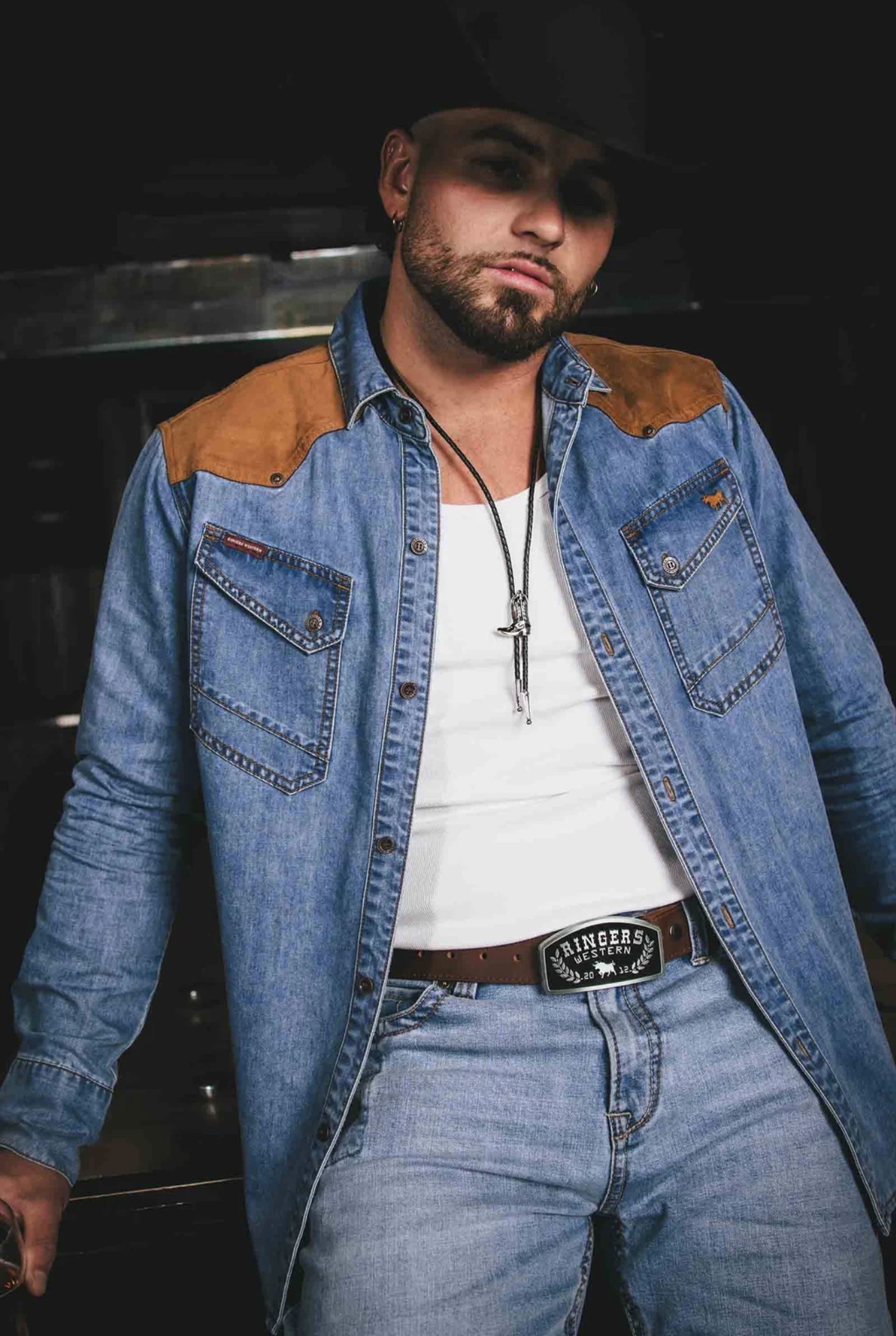 Emersxn modelling a denim Ringers Western shirt and belt